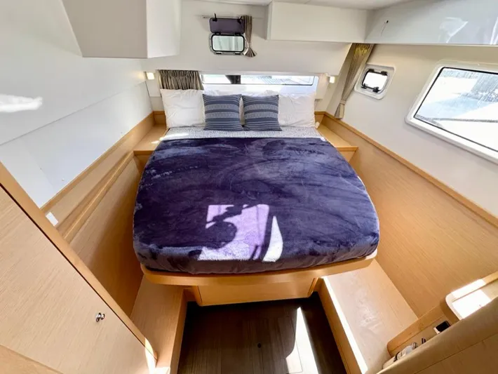 Never Say Never Yacht Photos Pics Luxurious cabin interior of 2017 Lagoon 42 catamaran with cozy bed and modern design.