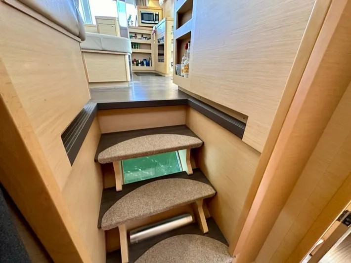 Never Say Never Yacht Photos Pics Interior of 2017 Lagoon 42 yacht with wooden stairs and modern furnishings.