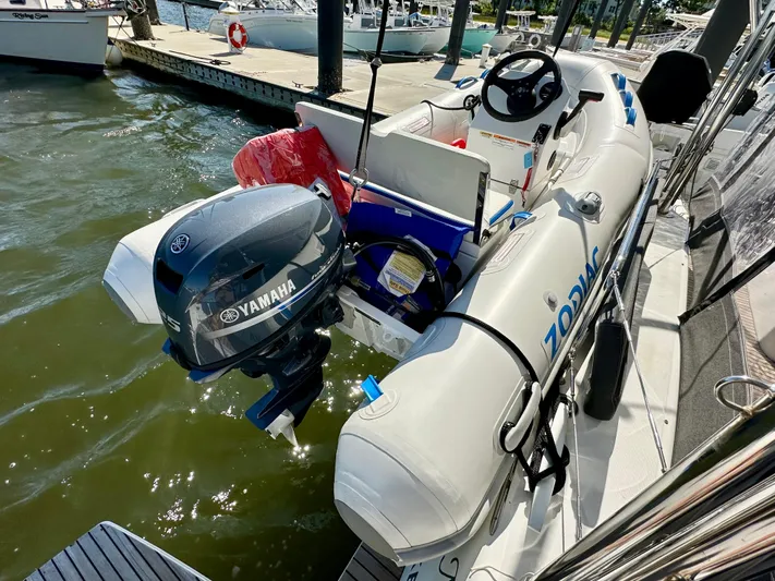 Never Say Never Yacht Photos Pics Inflatable boat with Yamaha motor docked beside Lagoon 42, 2017 model.