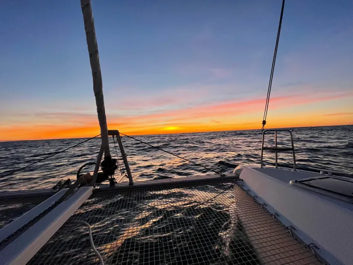 Never Say Never Yacht Photos Pics Lagoon 42 catamaran sailing at sunset, 2017 model, ocean view.