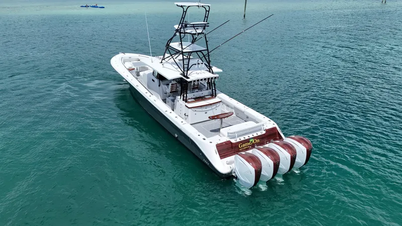  Yacht Photos Pics 2019 HCB 53 Sueños boat with multiple engines on clear blue water.