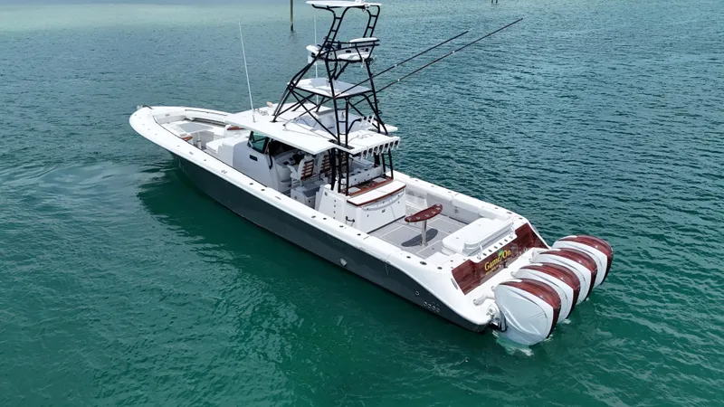  Yacht Photos Pics 2019 HCB 53 Sueños boat with four engines on clear blue water.