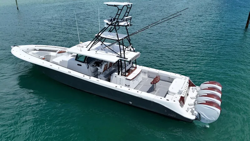  Yacht Photos Pics 2019 HCB 53 Sueños boat with multiple outboard engines on clear water.