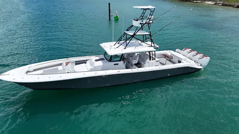  Yacht Photos Pics 2019 HCB 53 Sueños boat on turquoise water, featuring multiple outboard engines.