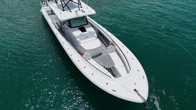  Yacht Photos Pics 2019 HCB 53 Sueños boat on clear blue water, aerial view.