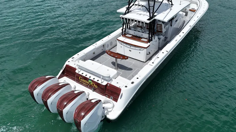  Yacht Photos Pics 2019 HCB 53 Sueños boat with four powerful engines on clear water.