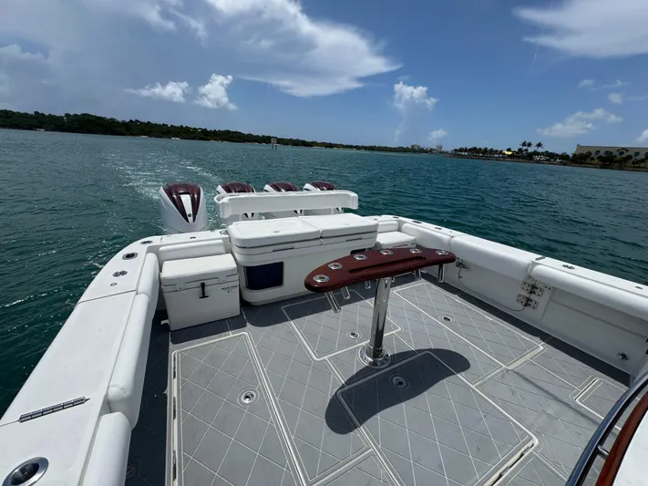 Yacht Photos Pics 2019 HCB 53 Sueños boat deck with seating, table, and ocean view.