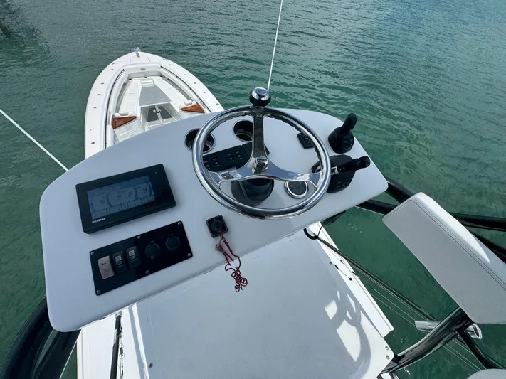  Yacht Photos Pics Helm of 2019 HCB 53 Sueños boat with steering wheel and controls.