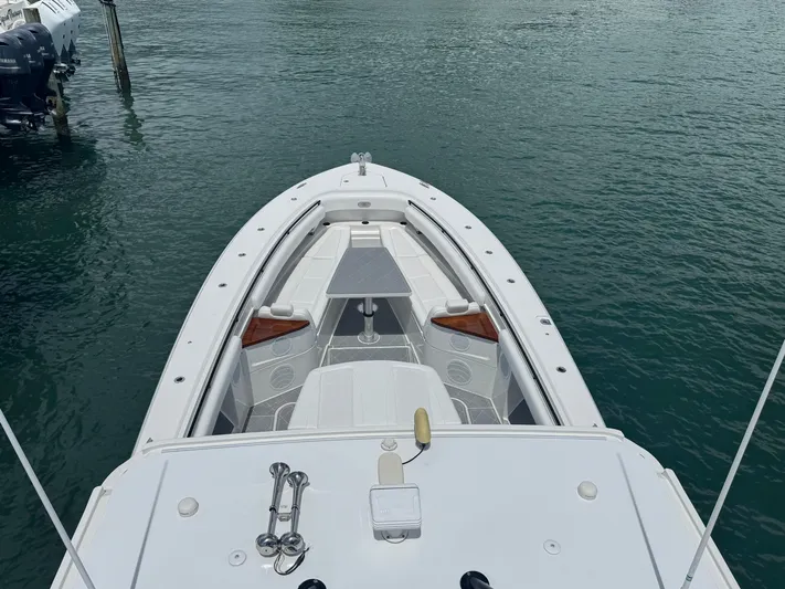  Yacht Photos Pics 2019 HCB 53 Sueños boat on water, viewed from above, showcasing sleek design and spacious deck.