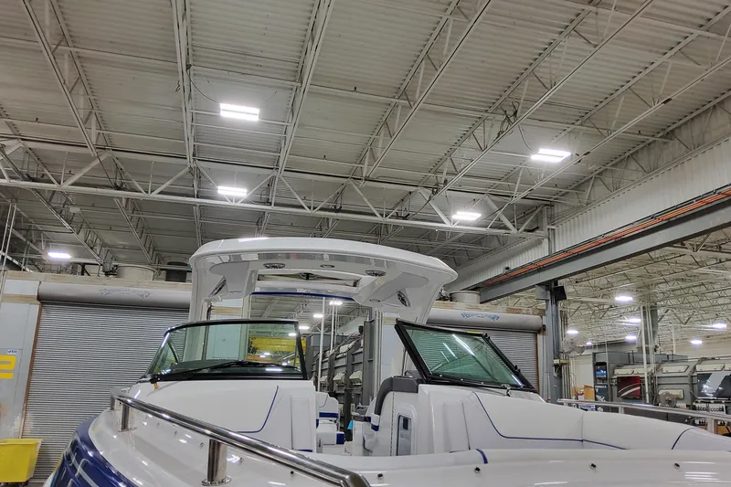  Yacht Photos Pics 2026 Formula 310 Bowrider I/O in a spacious indoor showroom.