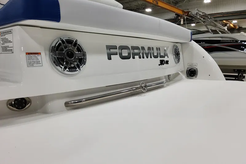  Yacht Photos Pics 2026 Formula 310 Bowrider I/O boat rear view with speakers and branding.
