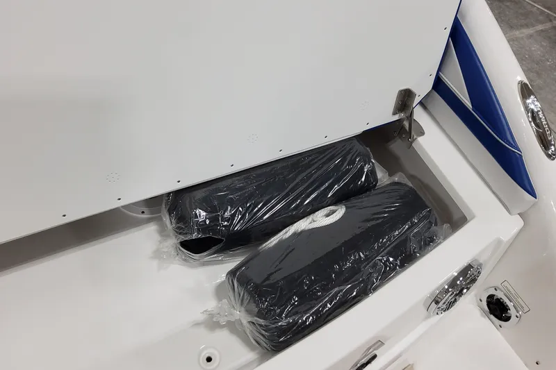  Yacht Photos Pics Storage compartment of 2026 Formula 310 Bowrider I/O with packaged accessories.