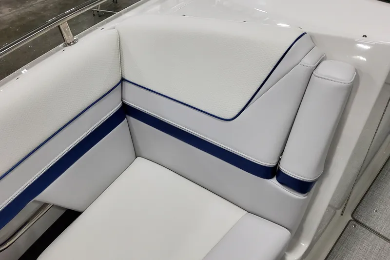  Yacht Photos Pics 2026 Formula 310 Bowrider I/O boat interior with white and blue cushioned seating.