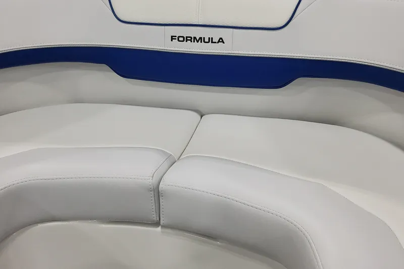  Yacht Photos Pics 2026 Formula 310 Bowrider I/O boat seating with white and blue upholstery.