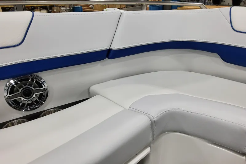  Yacht Photos Pics 2026 Formula 310 Bowrider I/O interior with white and blue seating and speaker detail.