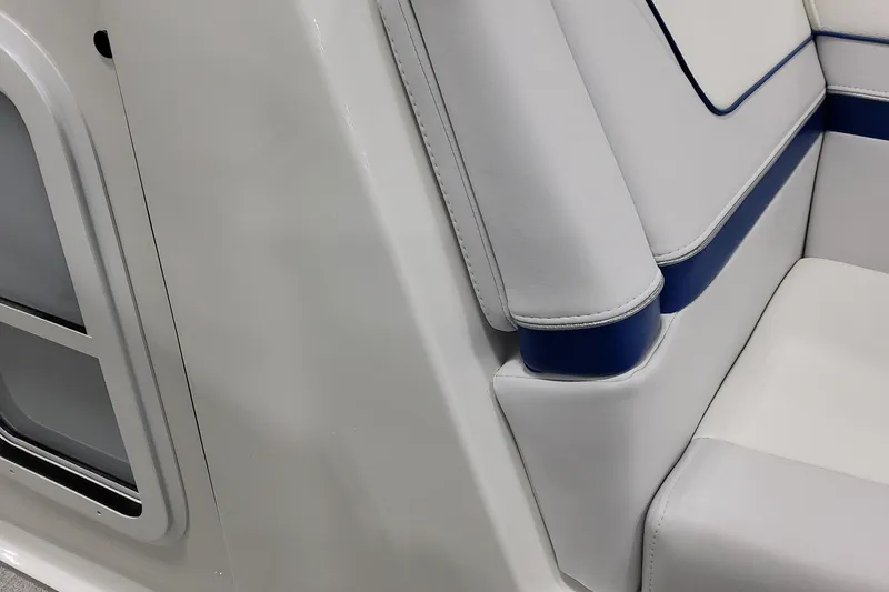  Yacht Photos Pics 2026 Formula 310 Bowrider I/O interior, featuring sleek white and blue seating design.