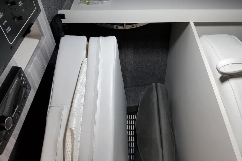  Yacht Photos Pics Interior view of 2026 Formula 310 Bowrider I/O, featuring white seating and control panel.