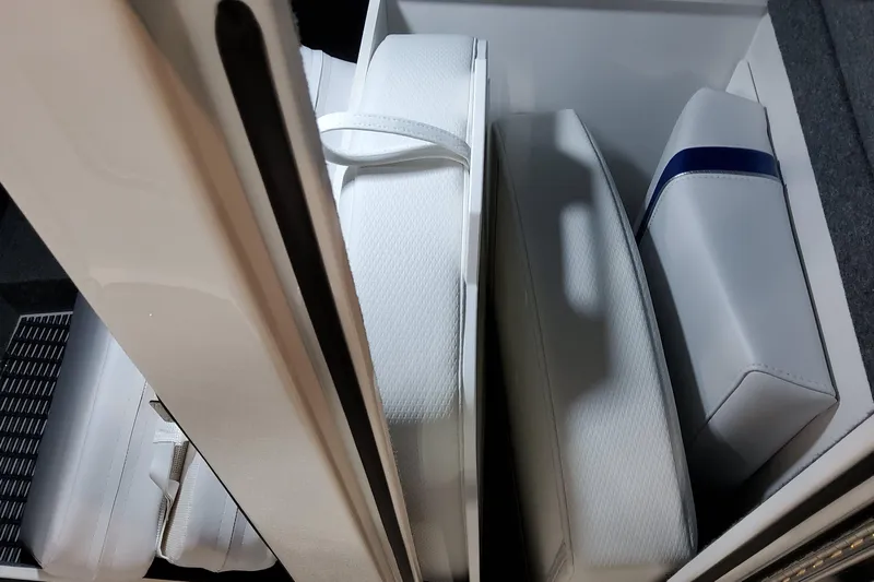  Yacht Photos Pics 2026 Formula 310 Bowrider I/O interior storage with white cushioned seats.