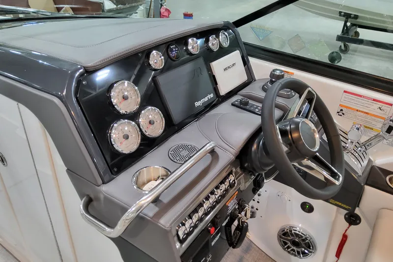  Yacht Photos Pics 2026 Formula 310 Bowrider I/O dashboard with steering wheel and control panel.