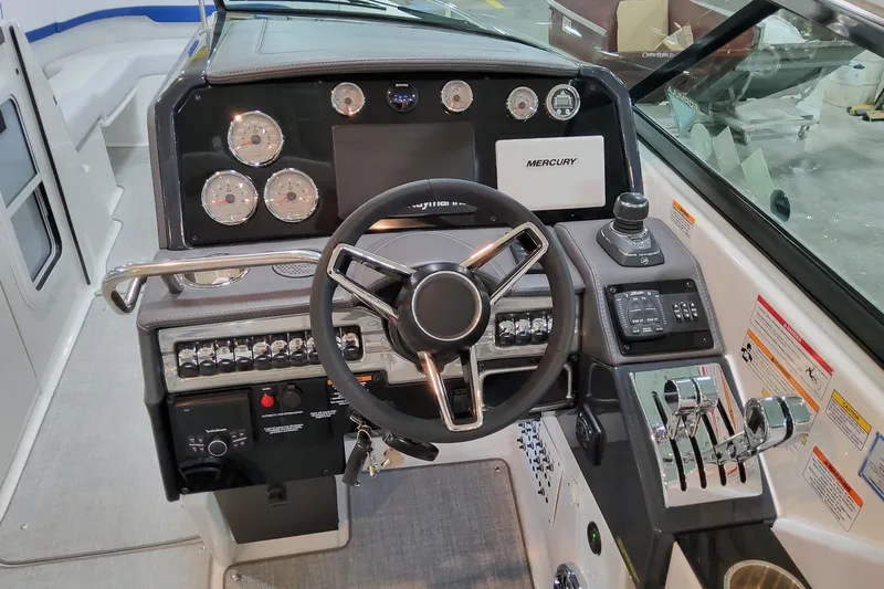  Yacht Photos Pics 2026 Formula 310 Bowrider I/O dashboard with steering wheel and control panel.