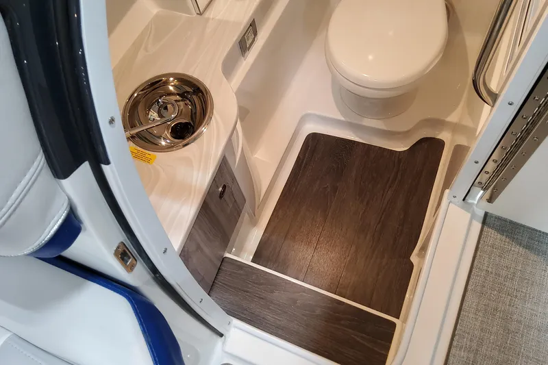  Yacht Photos Pics Interior of 2026 Formula 310 Bowrider I/O boat bathroom with sink and toilet.