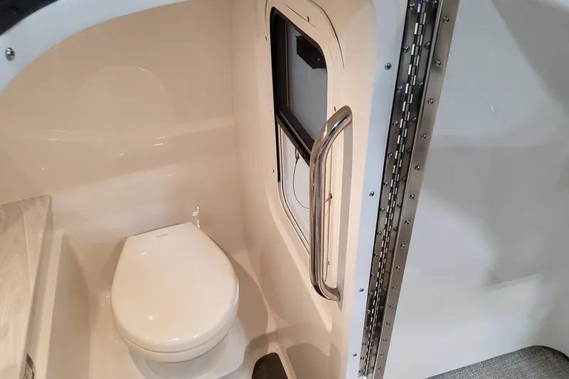  Yacht Photos Pics Interior of 2026 Formula 310 Bowrider I/O boat featuring a compact marine toilet.