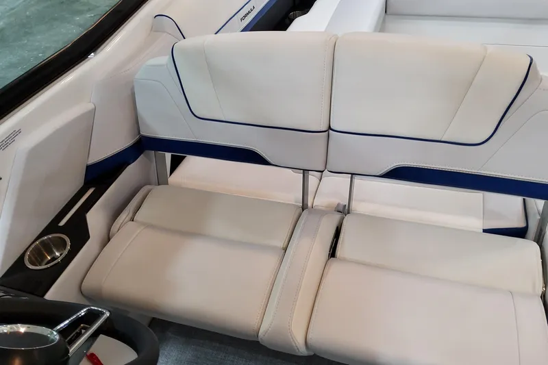  Yacht Photos Pics 2026 Formula 310 Bowrider I/O interior with sleek white and blue seating design.
