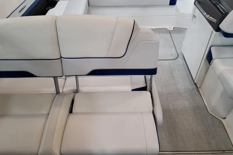  Yacht Photos Pics 2026 Formula 310 Bowrider I/O interior with luxurious white seating and modern design.