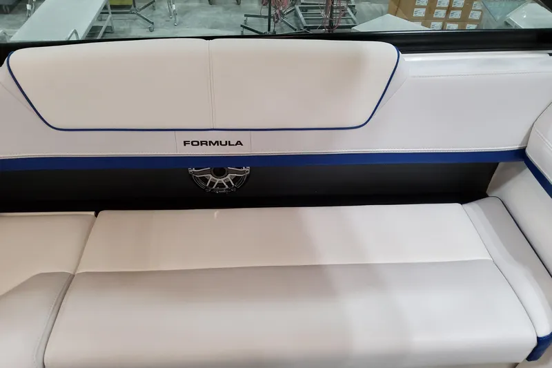  Yacht Photos Pics 2026 Formula 310 Bowrider I/O boat interior with white and blue seating.