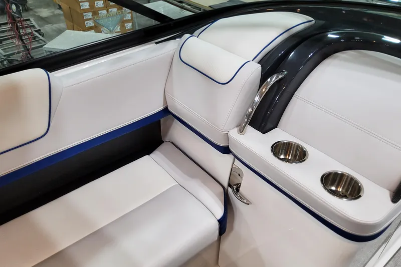  Yacht Photos Pics 2026 Formula 310 Bowrider I/O interior with white seating and cup holders.