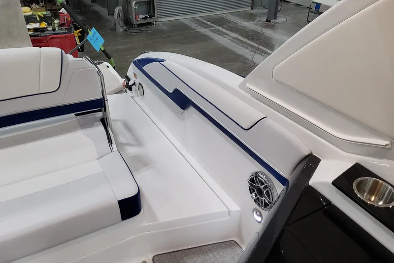  Yacht Photos Pics 2026 Formula 310 Bowrider I/O interior with white seating and blue accents.