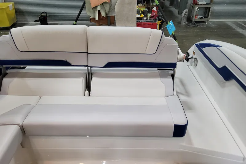  Yacht Photos Pics 2026 Formula 310 Bowrider I/O boat interior with white and blue seating.