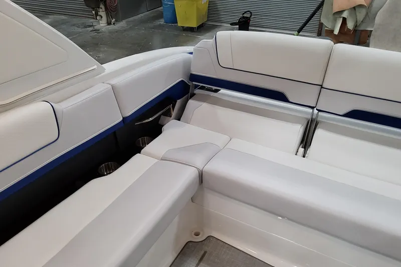  Yacht Photos Pics Luxurious seating in 2026 Formula 310 Bowrider I/O boat, featuring sleek white upholstery.