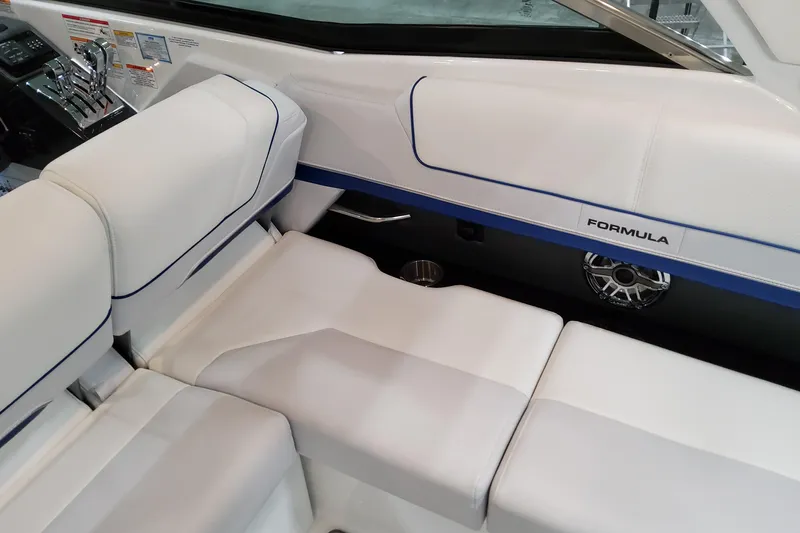  Yacht Photos Pics 2026 Formula 310 Bowrider I/O interior with white seating and sleek design.