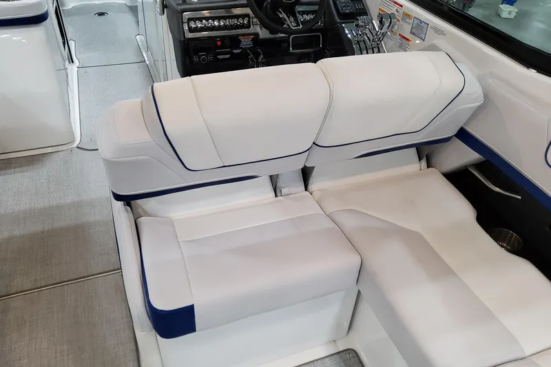  Yacht Photos Pics 2026 Formula 310 Bowrider I/O interior with white and blue seating, modern dashboard.
