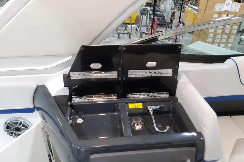  Yacht Photos Pics 2026 Formula 310 Bowrider I/O boat interior with sink and storage compartments.