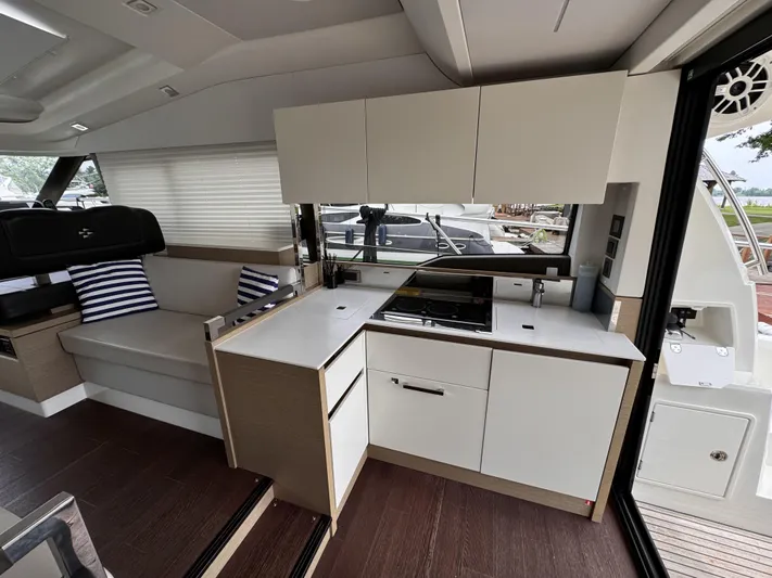  Yacht Photos Pics Modern kitchen interior of 2020 Prestige 460S yacht with sleek cabinetry and seating.