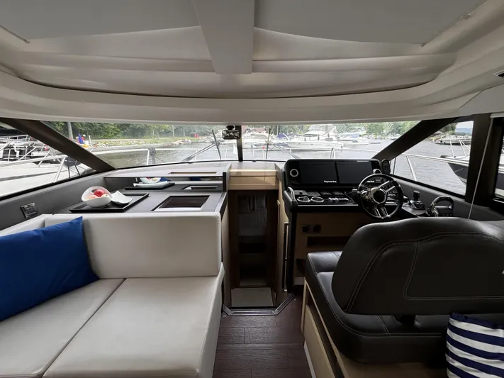  Yacht Photos Pics Interior of 2020 Prestige 460S yacht with modern helm and seating area.