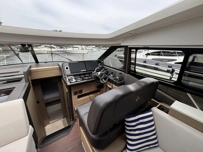  Yacht Photos Pics Interior of a 2020 Prestige 460S yacht with modern helm and seating.
