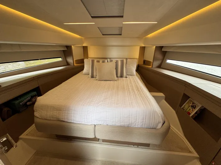  Yacht Photos Pics Luxurious bedroom interior of 2020 Prestige 460S yacht with modern design and ambient lighting.