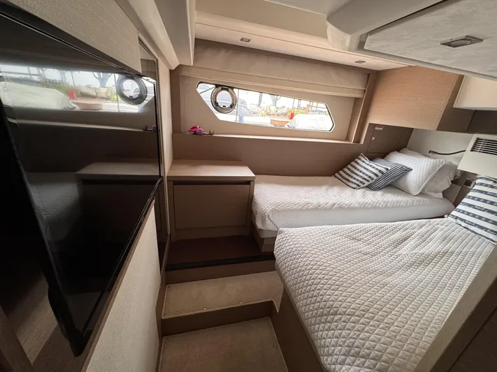  Yacht Photos Pics Luxurious cabin interior of 2020 Prestige 460S yacht with twin beds and modern decor.