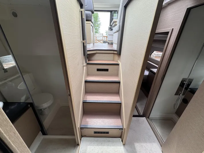  Yacht Photos Pics Interior stairs of 2020 Prestige 460S yacht, leading to upper deck with modern design.