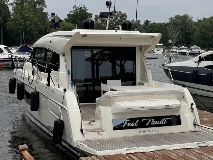  Yacht Photos Pics Prestige 460S 2020 yacht docked, rear view with "Feel Nauti" name, Montreal.