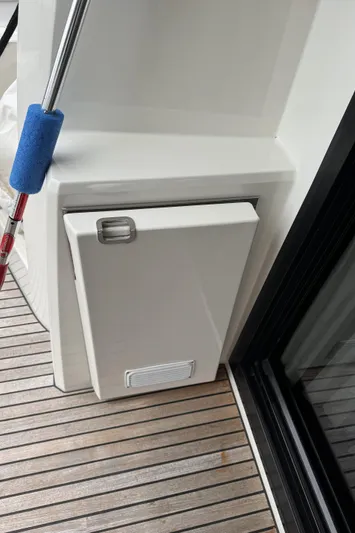  Yacht Photos Pics Prestige 460S 2020 yacht deck with storage compartment and wooden flooring.