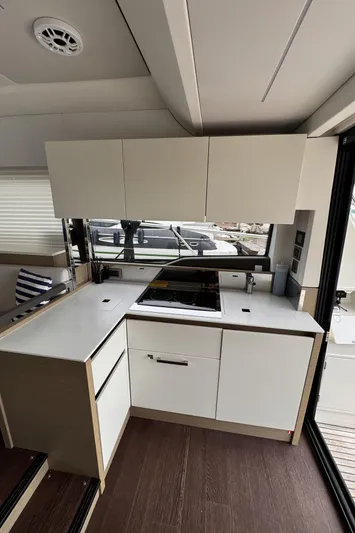  Yacht Photos Pics Modern kitchen interior of 2020 Prestige 460S yacht with sleek cabinetry and appliances.