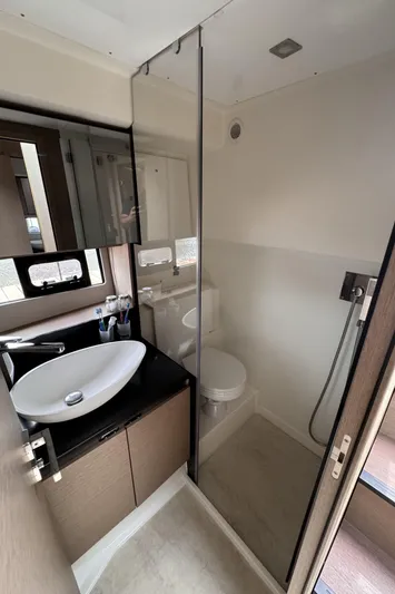  Yacht Photos Pics Modern bathroom in 2020 Prestige 460S yacht with sleek fixtures and glass shower.