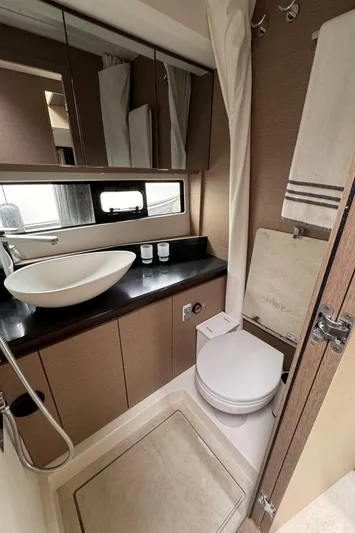  Yacht Photos Pics Luxury bathroom in 2020 Prestige 460S yacht with modern fixtures and elegant design.