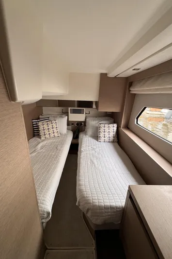  Yacht Photos Pics Interior of 2020 Prestige 460S yacht with twin beds and nautical decor.