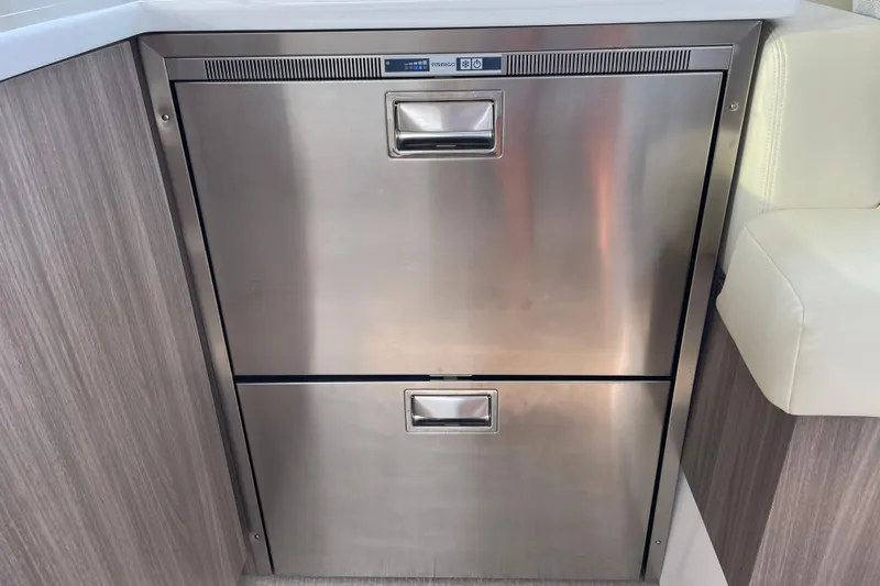 It's About Time Yacht Photos Pics Stainless steel refrigerator drawers on 2022 Regal 38 Grande Coupe yacht interior.