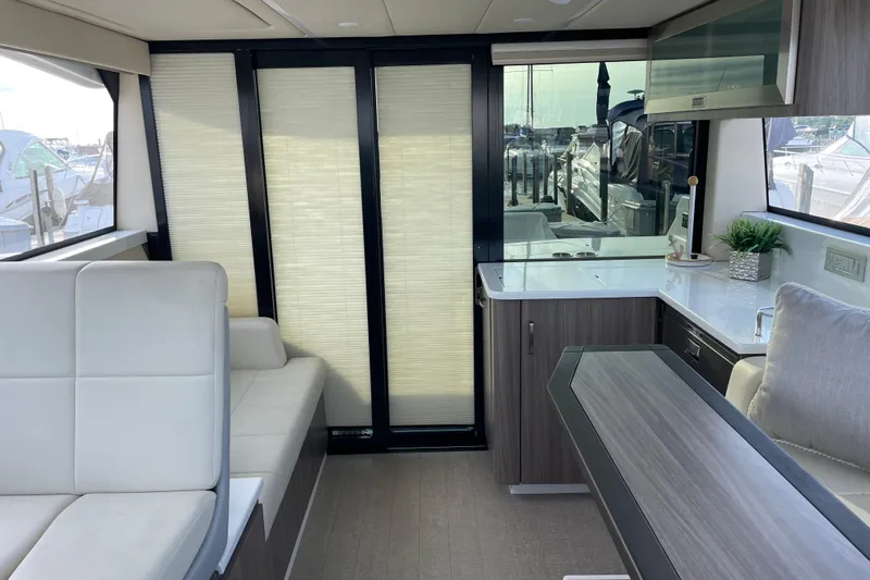 It's About Time Yacht Photos Pics Luxurious interior of 2022 Regal 38 Grande Coupe yacht with modern furnishings.